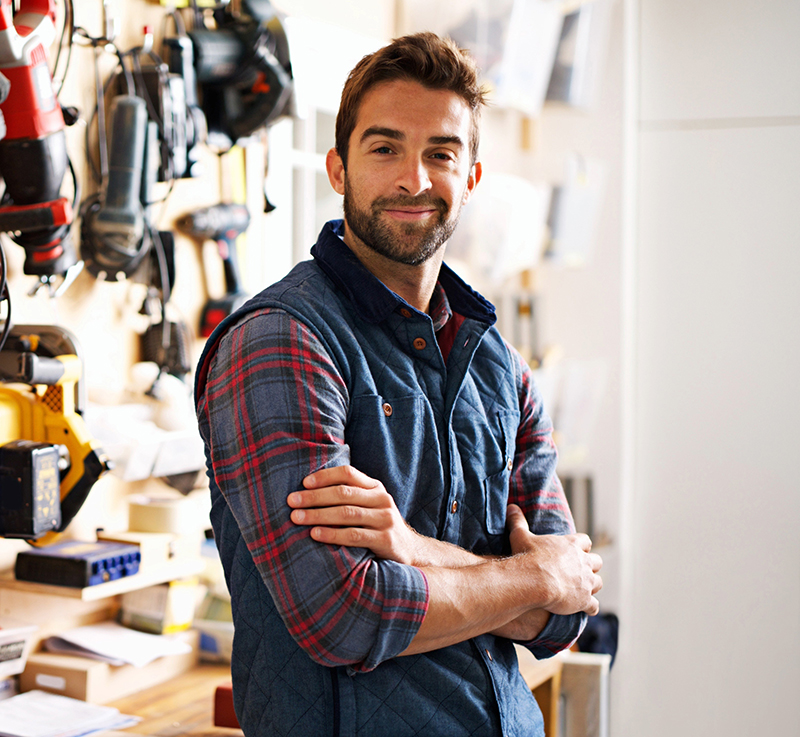 HVAC contractor standing in workshop